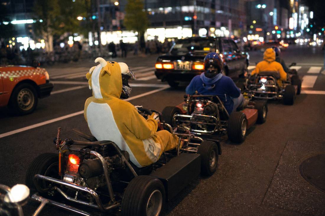 Go-karts queued at an Akihabara intersection at dusk