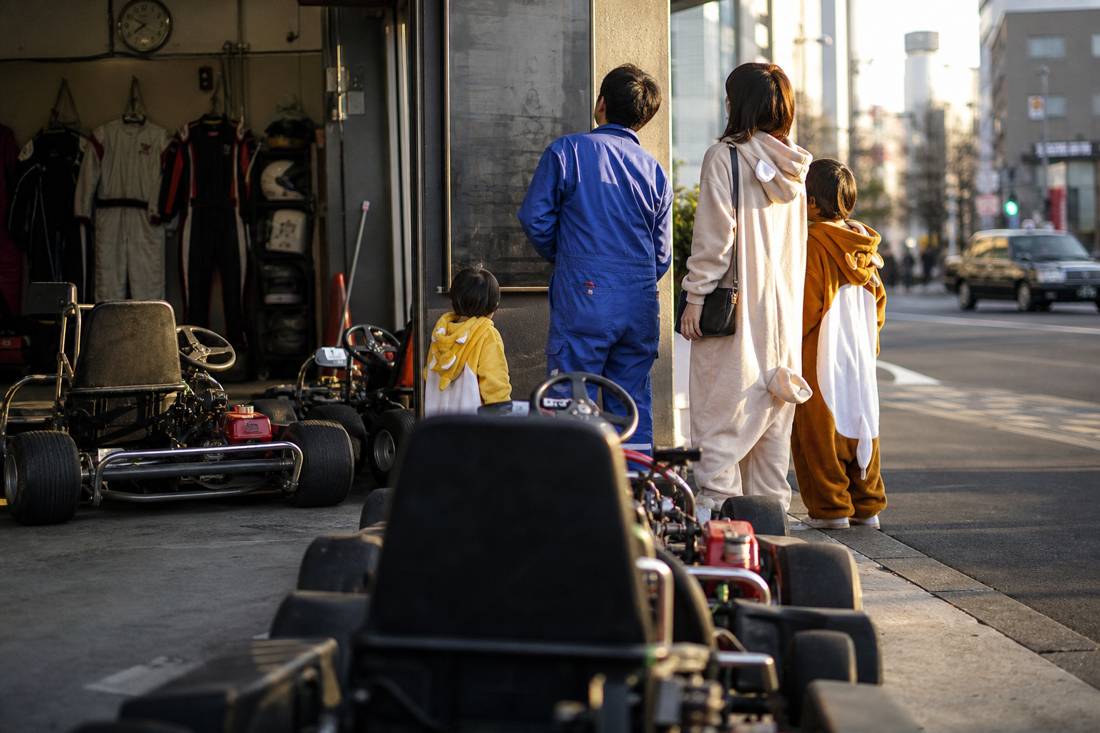 Go-karts parked outside a Tokyo garage