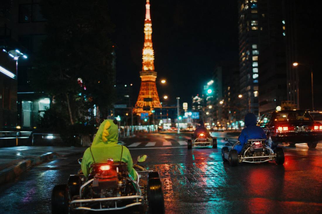 Daytime go-kart view of Tokyo Tower against blue sky