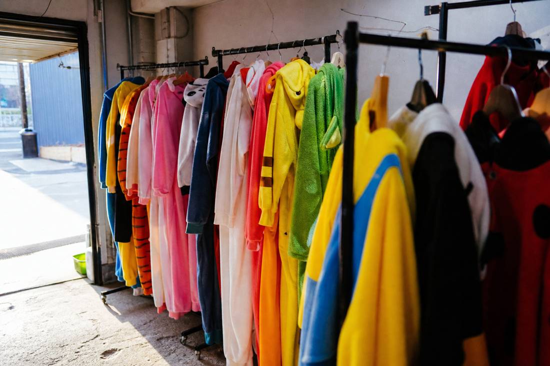 Racks of colorful costumes in a Tokyo go-kart garage