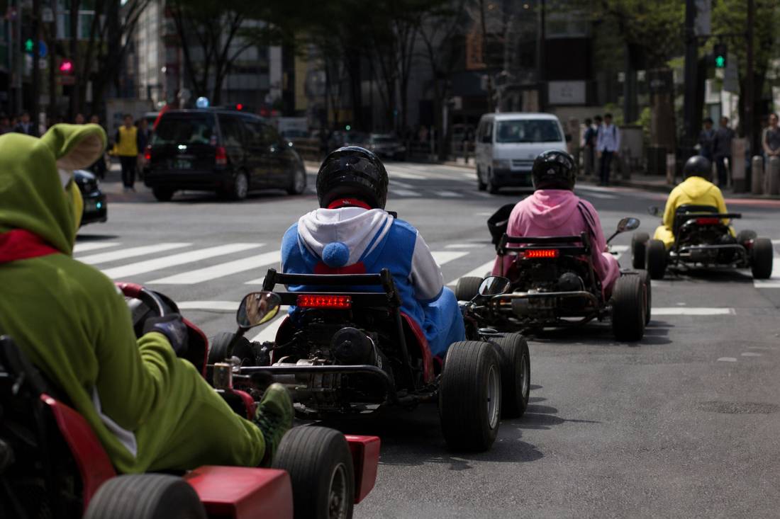 A go-kart convoy rolling out for a tour through Shibuya