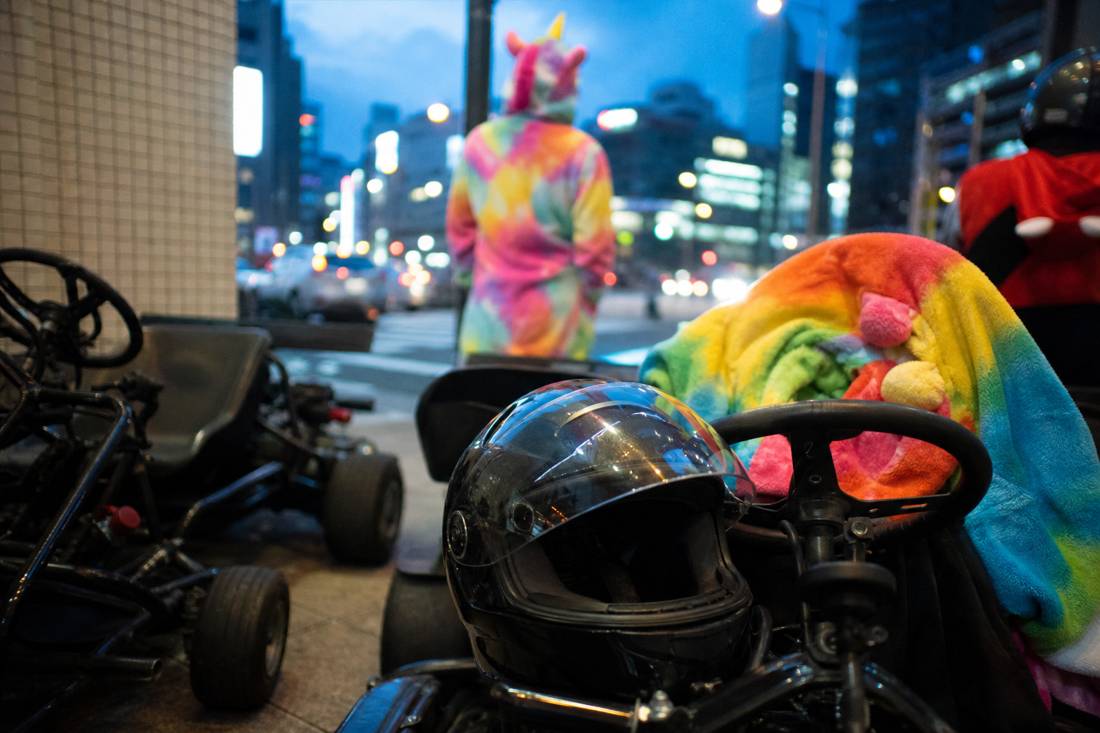 Go-kart and helmet gear laid out before a Tokyo tour