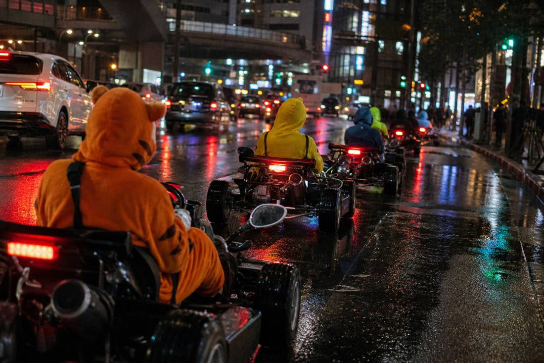 A night go-kart convoy in Tokyo neon