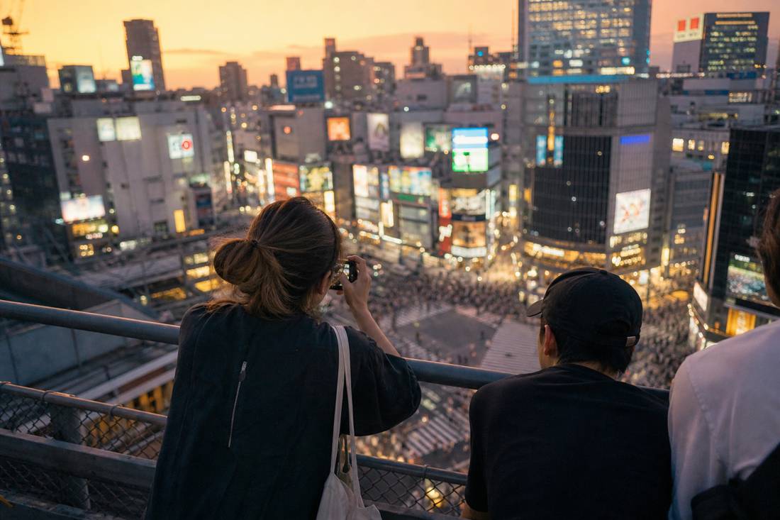 Shibuya rooftops at blue hour with the crossing below