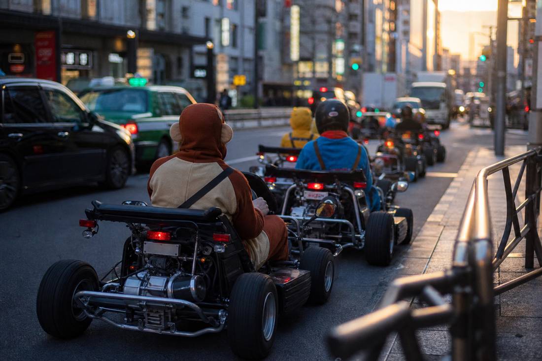 A go-kart convoy pulling onto a Tokyo street