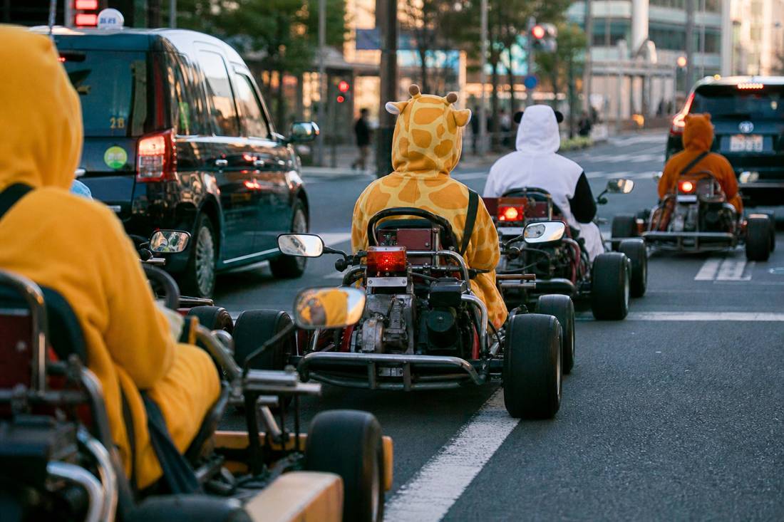 An orderly go-kart convoy at a Tokyo red light