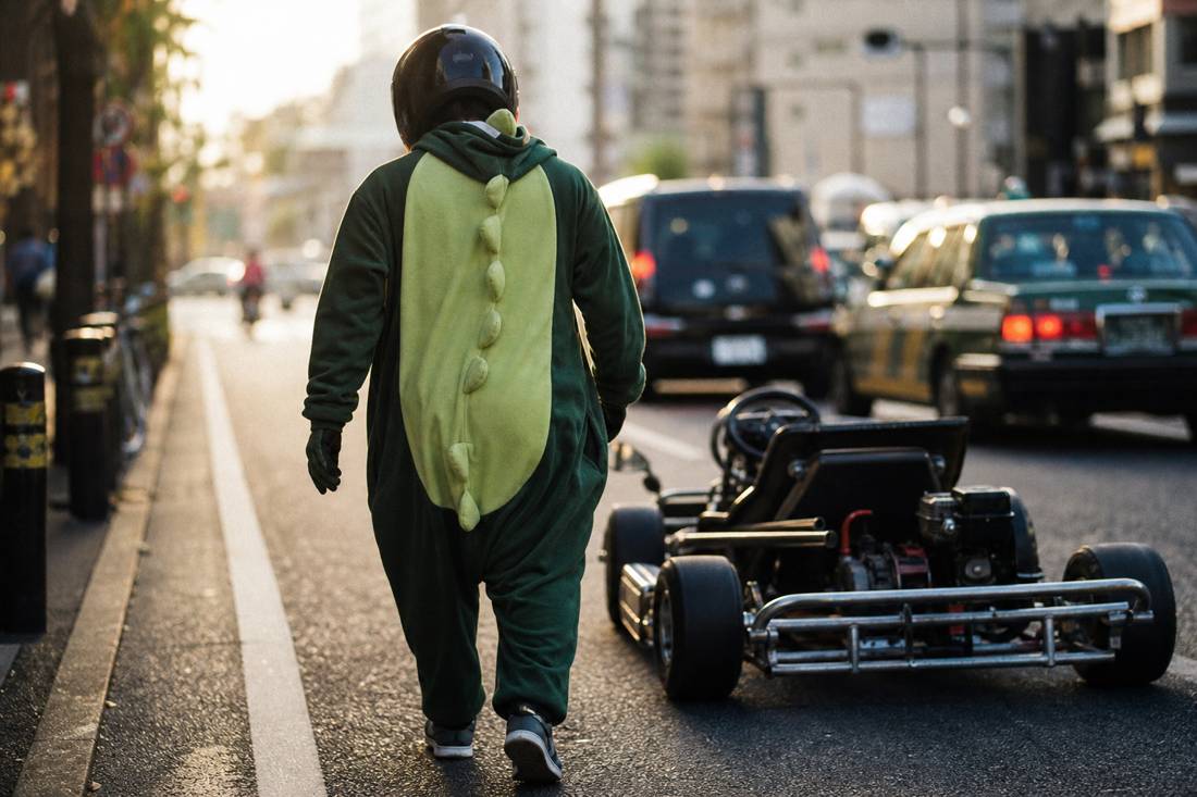A cleared driver walking to their go-kart in Tokyo