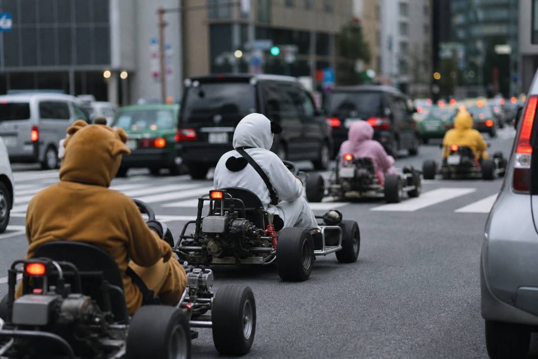A go-kart convoy rolling onto the Tokyo street
